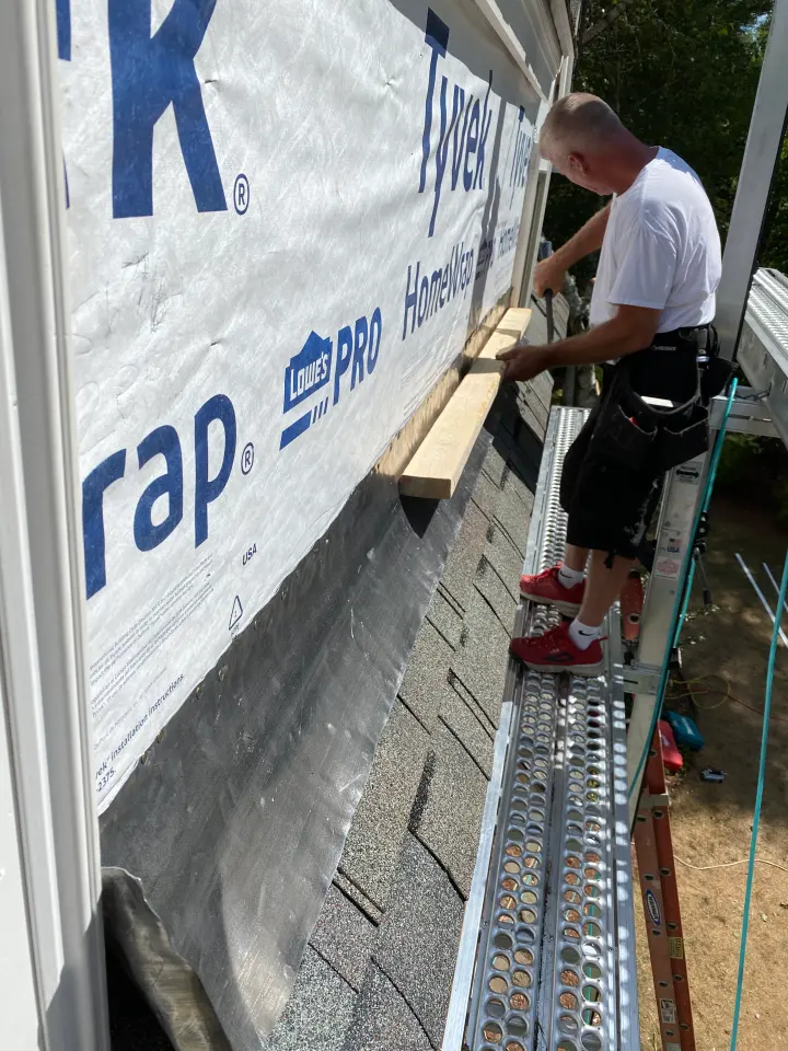 Installing trim over house wrap during a siding job